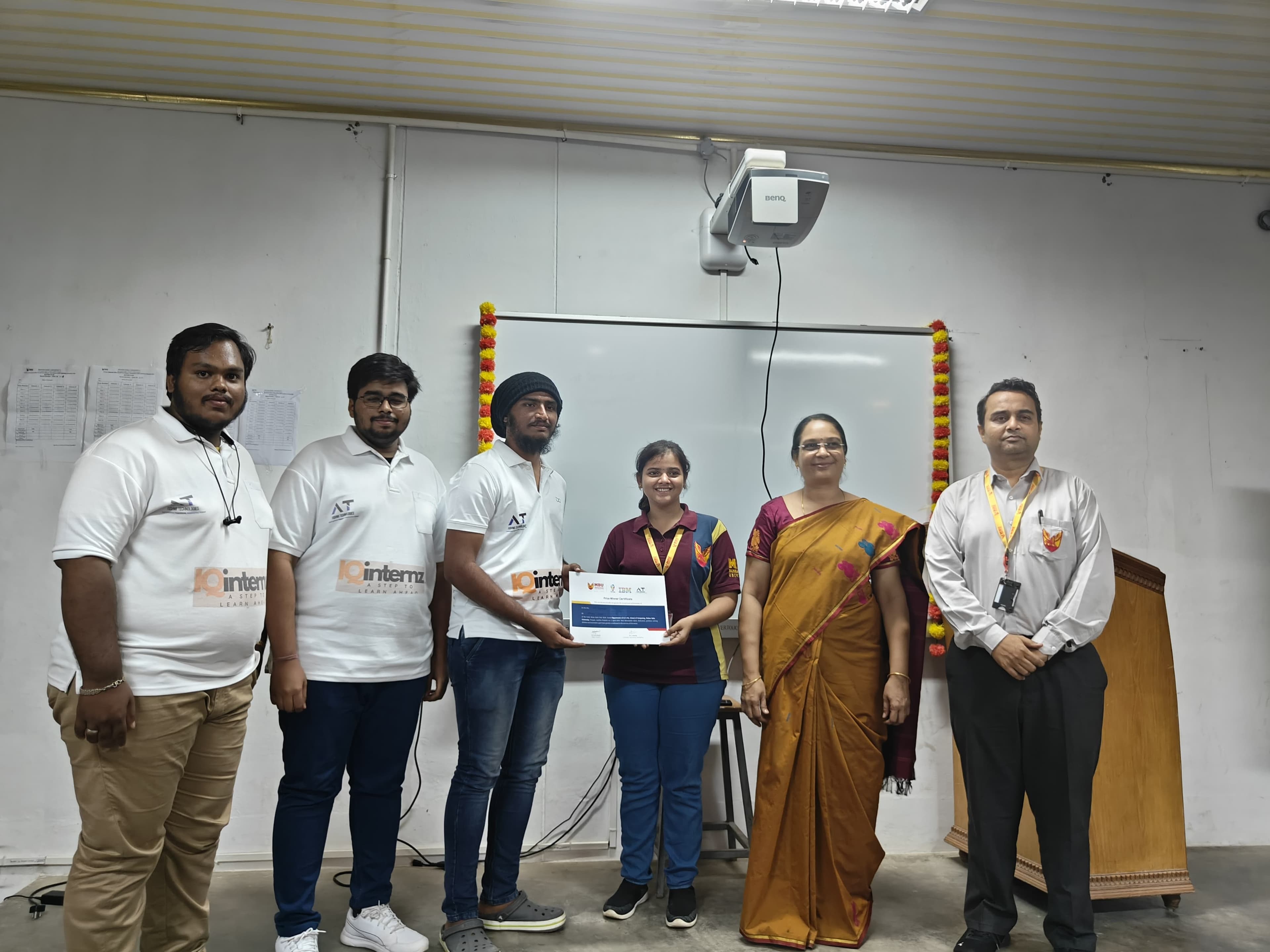 Sraventix-trained students receiving a prize-winner certificate from university officials at the IQ Internz awards